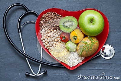 Healthy food on red heart plate Stock Photo