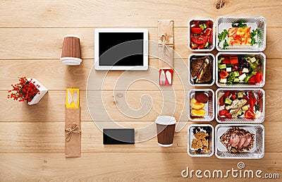 Healthy food take away in boxes, top view at wood Stock Photo