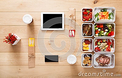 Healthy food take away in boxes, top view at wood Stock Photo