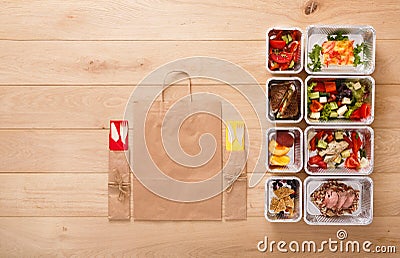 Healthy food take away in boxes, top view at wood Stock Photo