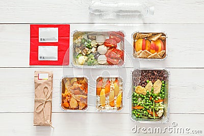 Healthy food take away in boxes, top view at wood Stock Photo