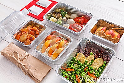 Healthy food take away in boxes, top view at wood Stock Photo