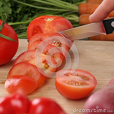 Healthy food tomato vegetables slicing on a kitchen board Stock Photo