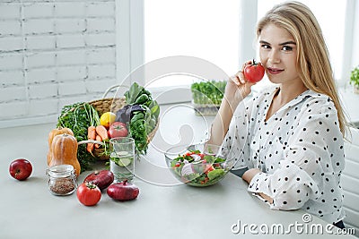 Healthy food woman. Beautiful woman eats a salad. Stock Photo