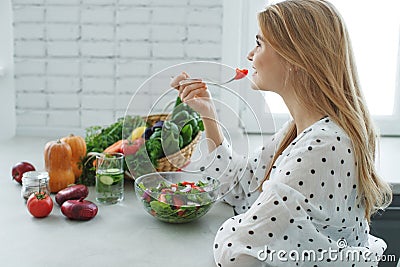 Healthy food woman. Beautiful woman eats a salad. Stock Photo