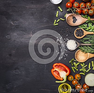 Healthy foods, cooking and vegetarian concept cherry tomatoes, wild rice, spices, salt border ,place text on wooden rustic b Stock Photo