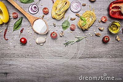 Healthy foods, cooking and vegetarian concept pasta with flour, vegetables, oil and herbs on wooden rustic background top view bor Stock Photo