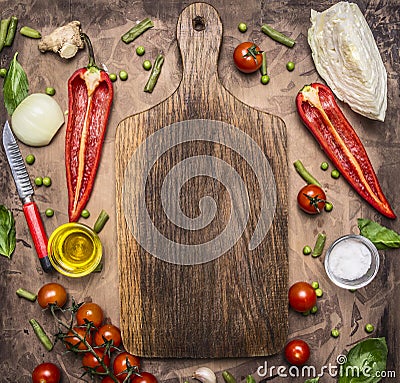 Healthy foods, cooking and vegetarian concept variety of vegetables and fruits are laid out around the cutting board, place for te Stock Photo