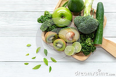 Healthy Foods. Organic and Fresh green vegetable for detox, diet and weight loss on the white wooden. Stock Photo