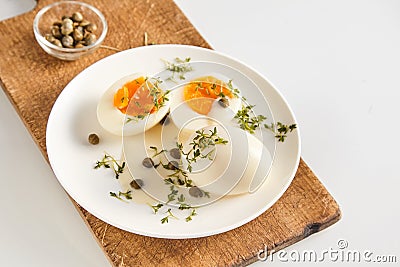 Healthy free range eggs in caper and mustard sauce Stock Photo