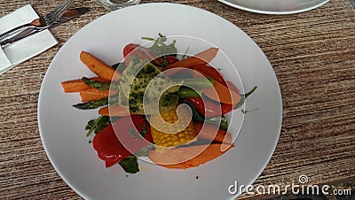 Healthy colorful vegetables on white plate Stock Photo