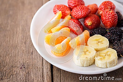 Healthy fresh fruits in a plate. Stock Photo