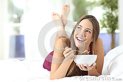 Healthy girl eating cereals at breakfast Stock Photo