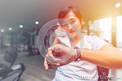 Healthy Girl looking Fitness Tracker Smart Health Bracelet Stock Photo