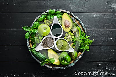Healthy Green food Clean eating selection Protein source for vegetarians: avocado, lime, onion, apple, kiwi, spirulina. Stock Photo