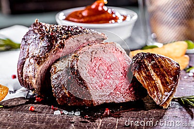 Healthy grilled medium-rare beef steak and vegetables with roasted Potatoes Stock Photo
