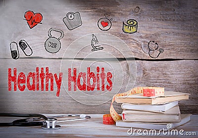 Healthy habits Concept. Stack of books and a stethoscope on a wooden background Stock Photo