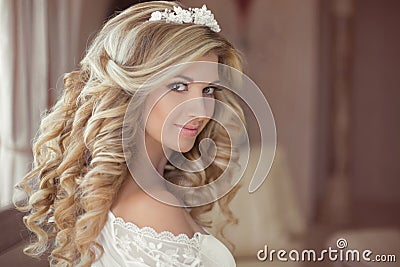 Healthy hair. Beautiful smiling girl bride with long blonde curl Stock Photo