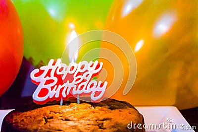 Healthy homemade cake with balloons and candle Stock Photo