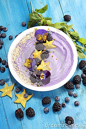 Healthy homemade raw vegan banana and berry ice cream icecream, nicecream topped with organic blackberries and blueberry Stock Photo