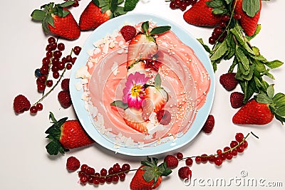 Healthy homemade raw vegan banana and berry ice cream icecream, nicecream topped with organic strawberries Stock Photo