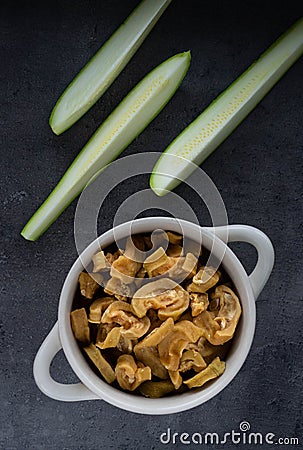 Healthy homemade vegetable chips from zucchini. Organic diet food. The vegan diet. Dried vegetables. Stock Photo