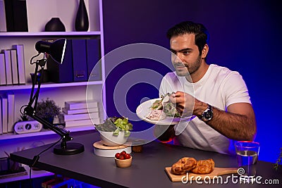 Healthy influencer in host channel taste chicken meat. Surmise. Stock Photo