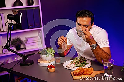 Healthy influencer in host channel taste chicken meat. Surmise. Stock Photo