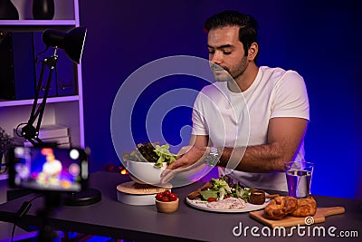 Healthy influencer presenting cold fresh vegetables on diet life. Surmise. Stock Photo