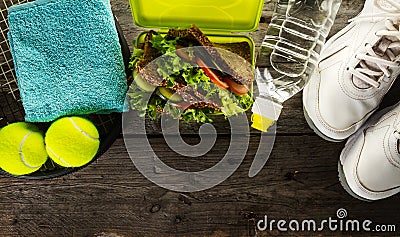 Healthy Life Sport Concept. Sneakers with Lunch Box, Towel and B Stock Photo