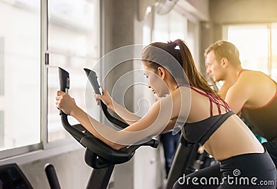Healthy lifestyle concept,Young teen woman workout with cycling doing cardio training indoor center,Close up Stock Photo