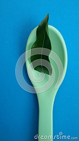 Spoon with leaf. Natural ingredients. Healthy food concept. Stock Photo