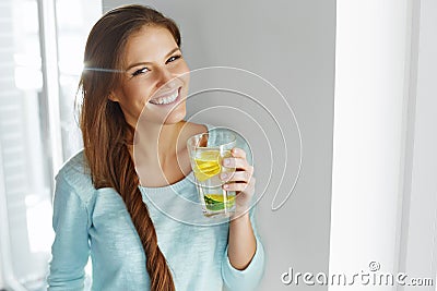 Healthy Lifestyle And Food. Woman Drinking Fruit Water. Detox. H Stock Photo