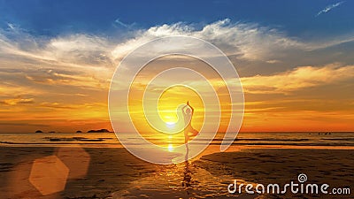 Healthy lifestyle. Silhouette meditation yoga woman on background of the sea and sunset. Stock Photo