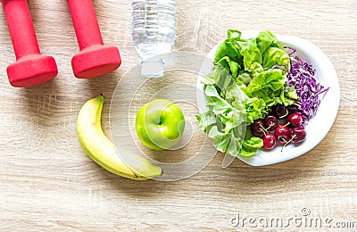 Healthy lifestyle for women diet with sport equipment, sneakers, measuring tape, fruit healthy green apples and bottle of water on Stock Photo