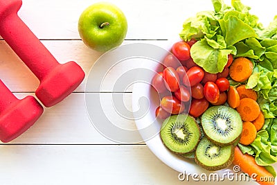 Healthy lifestyle for women diet with sport equipment, vegetable and fruits fresh, green apples on wooden. Stock Photo