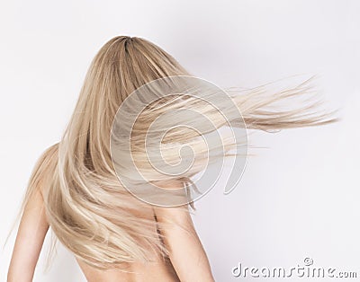 Healthy long platinum blonde hair in motion. Stock Photo