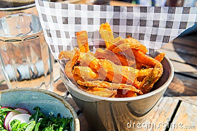 Lunch with Salad from grilled Broccoli and Baked Sweet Potato Fries Stock Photo