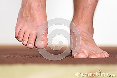 Healthy male feet stepping Stock Photo