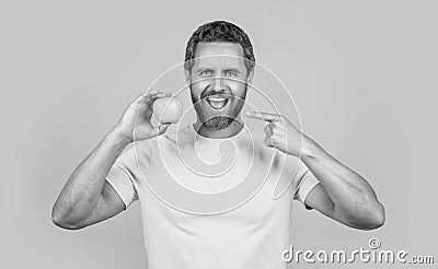 healthy man pointing on vitamin fruit on background. healthy man with vitamin fruit Stock Photo