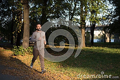 Healthy man running in the morning. Stock Photo