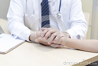 Healthy and medical concept. Doctor holding patient hand to give Stock Photo