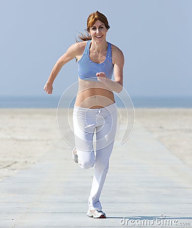 Healthy middle aged woman enjoying a jog Stock Photo