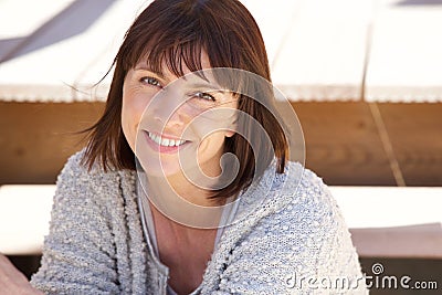 Healthy older woman smiling outside Stock Photo