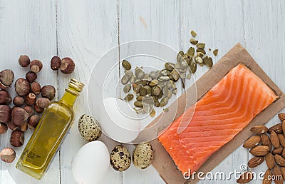 Healthy organic food. Products with healthy fats. Omega 3 omega 6. Ingredients and products: trout salmon olive oil avocado nuts Stock Photo