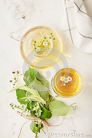 Healthy organic herbal linden, camomile tea. Natural warm beverage, cozy table setting Stock Photo