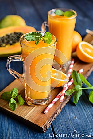 Healthy papaya, orange and mango smoothie Stock Photo