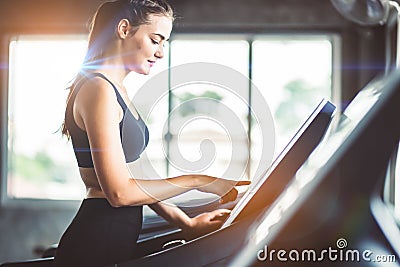 Healthy People running on machine treadmill at fitness gym, Work Stock Photo