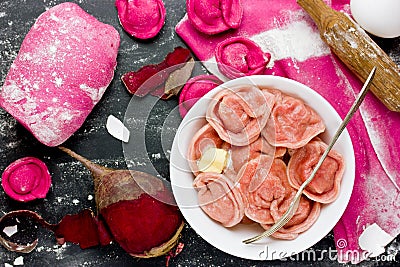 Healthy pink beetroot dumplings or ravioli stuffed with meat. Fr Stock Photo