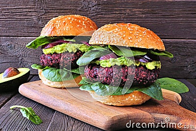 Healthy plant based beet burgers with avocado and spinach Stock Photo
